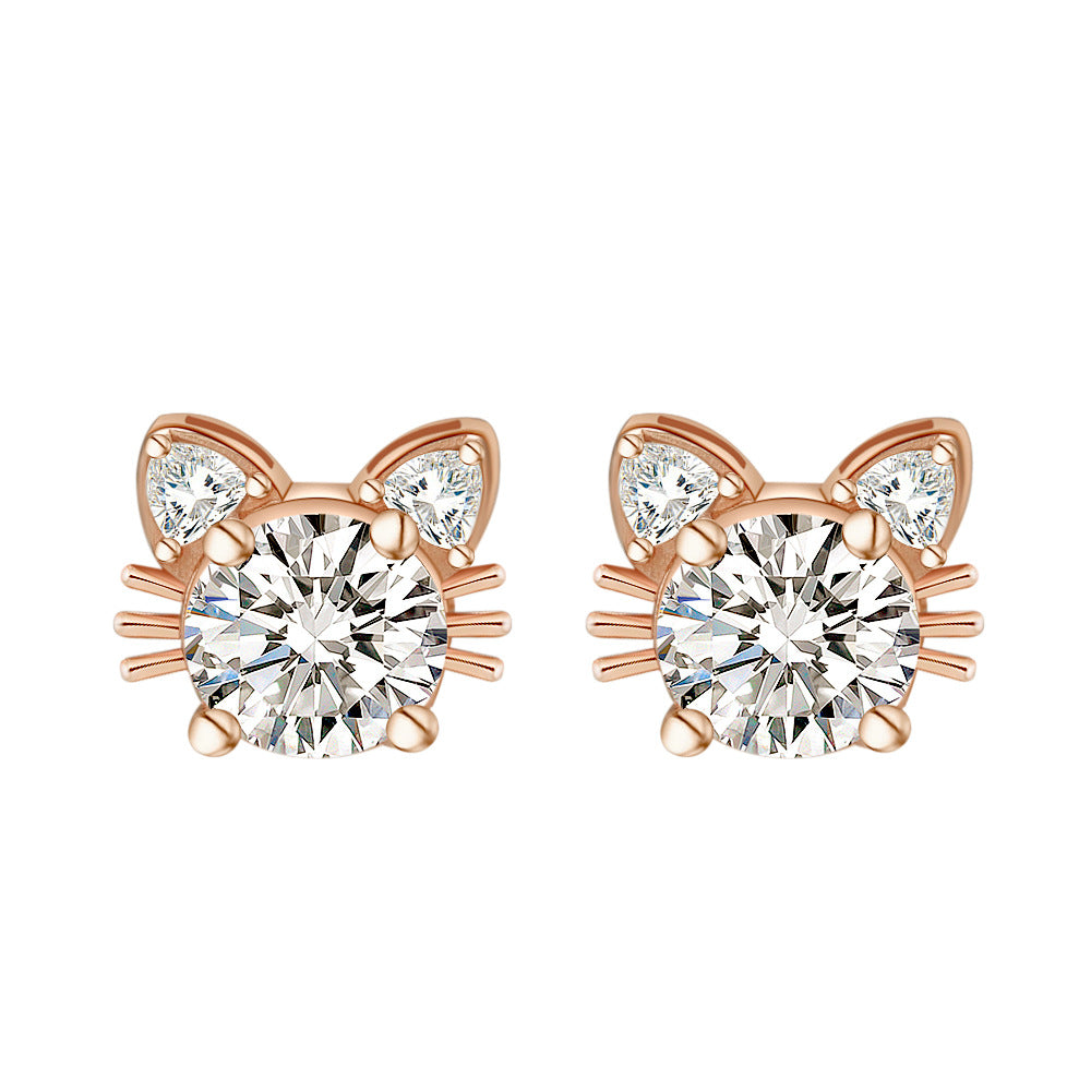 Cat-shaped earrings with rose gold and clear gemstones on a white background